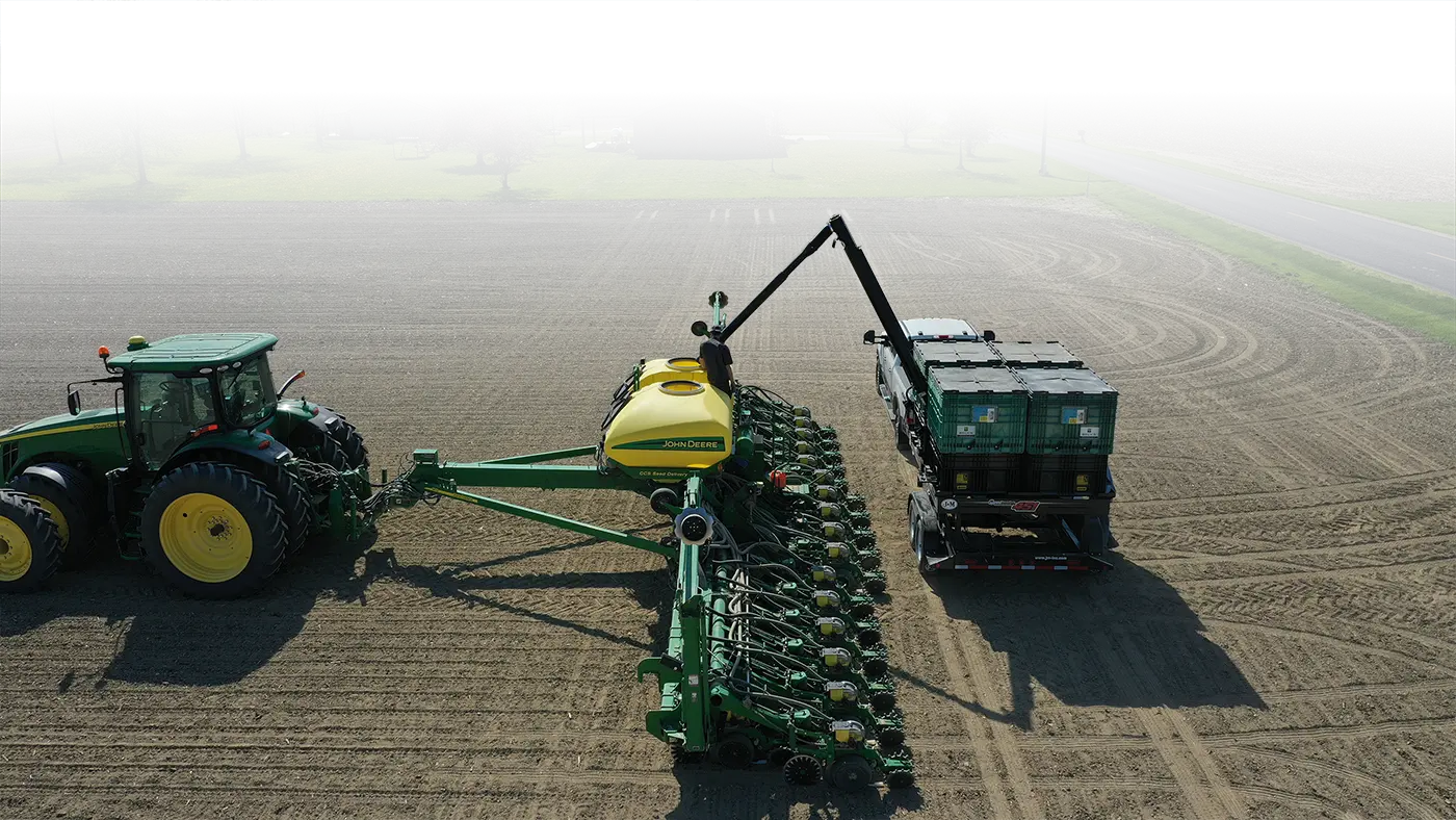 Filling a planter with a Pro Box Seed Tender