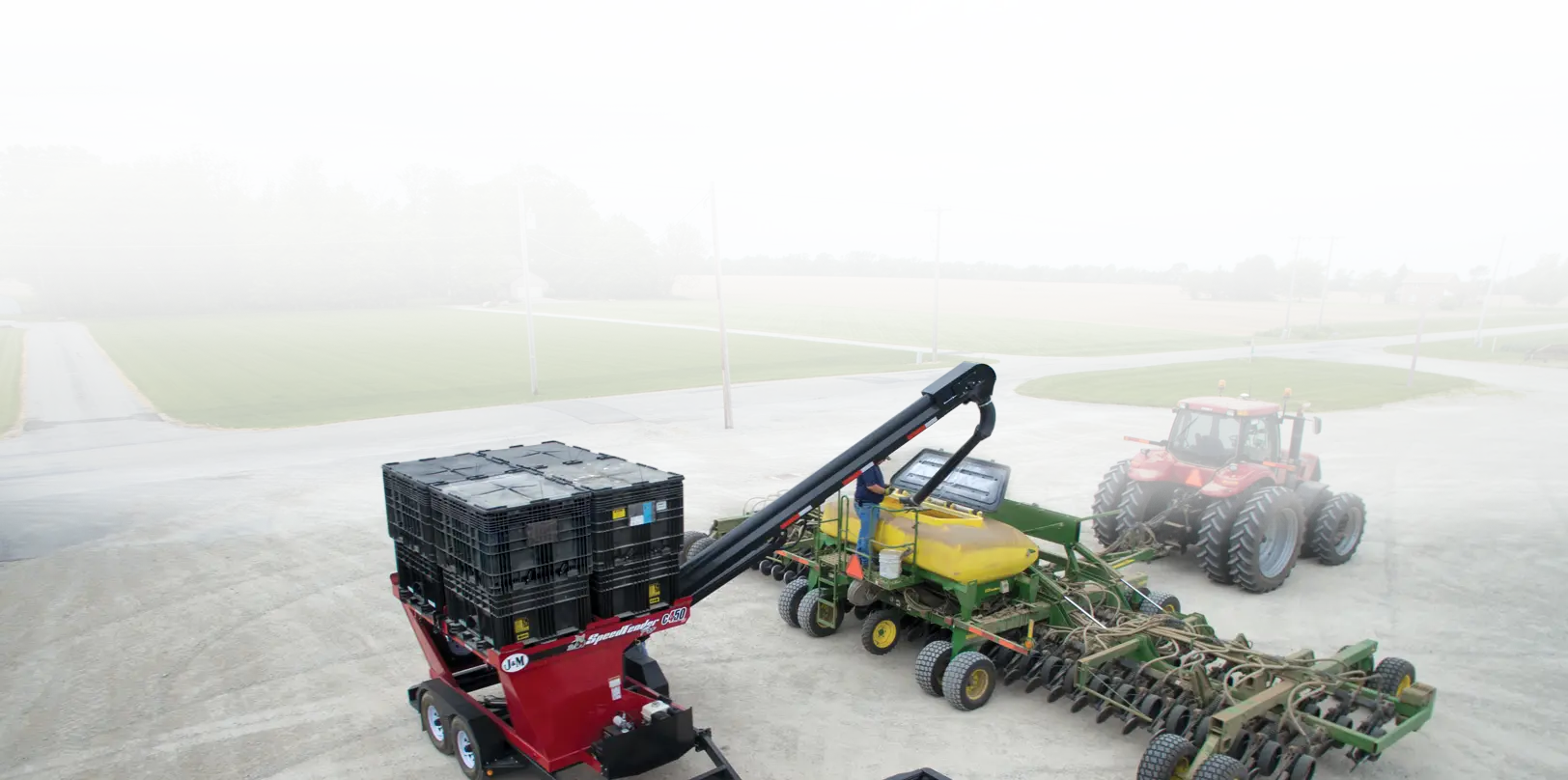 Red c4•50 Pro Box Seed Tender Filling a Planter