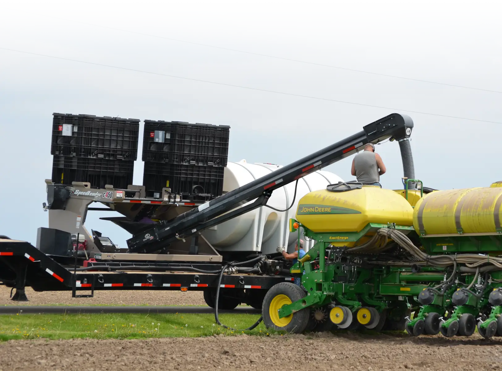 Filling a planter with a c4•50 Pro Box Seed Tender