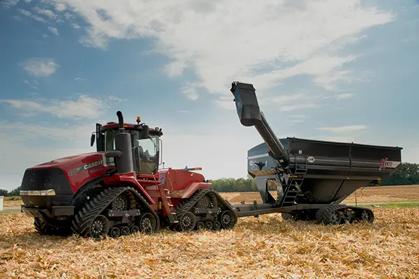 black 1112 with v4 lt tracks sitting in a field