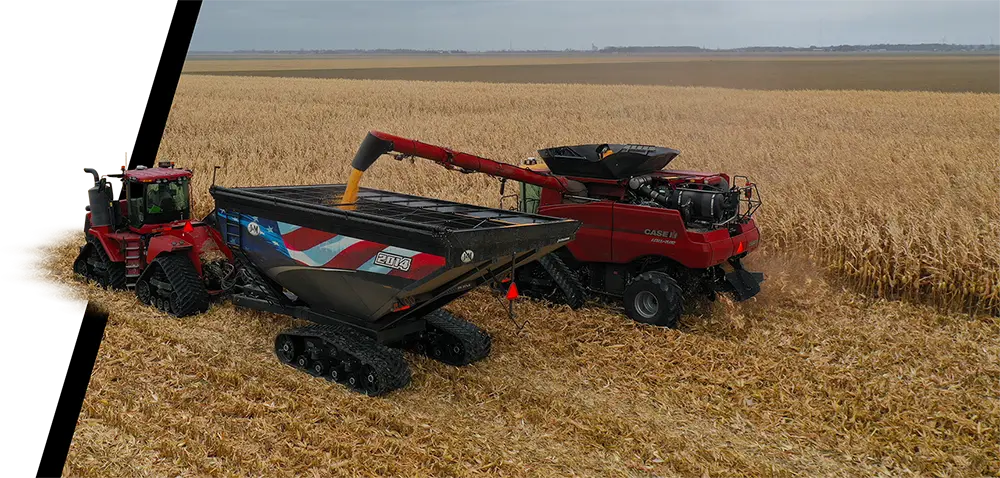 biggest single-auger grain cart receiving grain from a combine