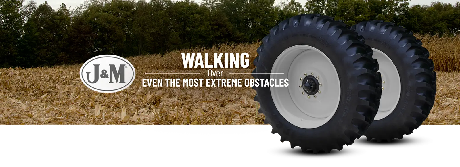 Walking tandem wheels in front of a field.