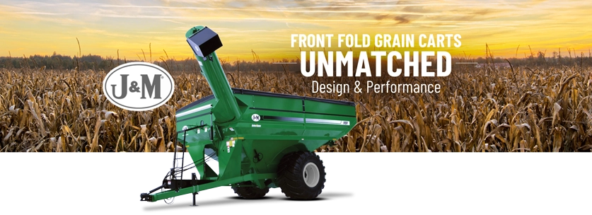 Green Grain Cart in Front of Corn Field