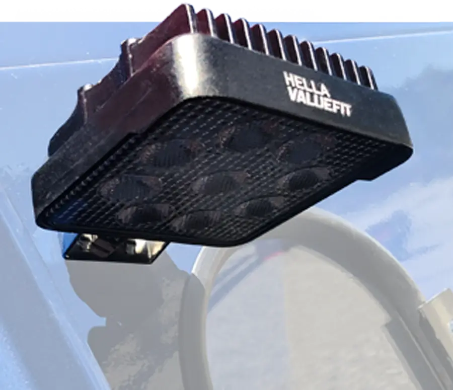 A work light on a 385 gravity wagon that illuminates the door and chute area for easy unloading in low light conditions.