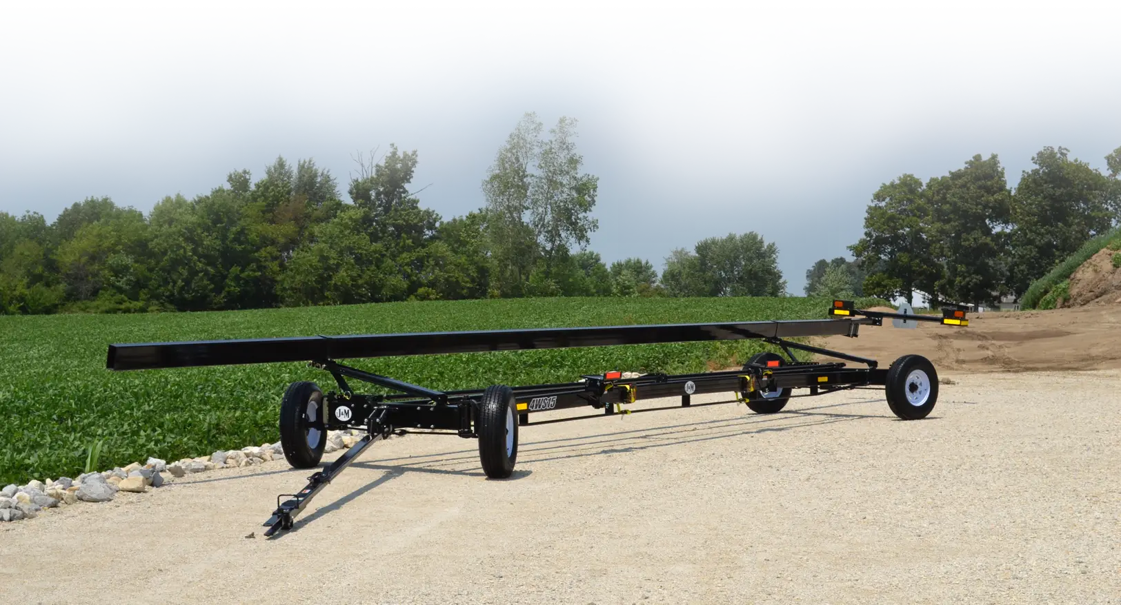 4-Wheel Steer Header Transport in Front of a Field