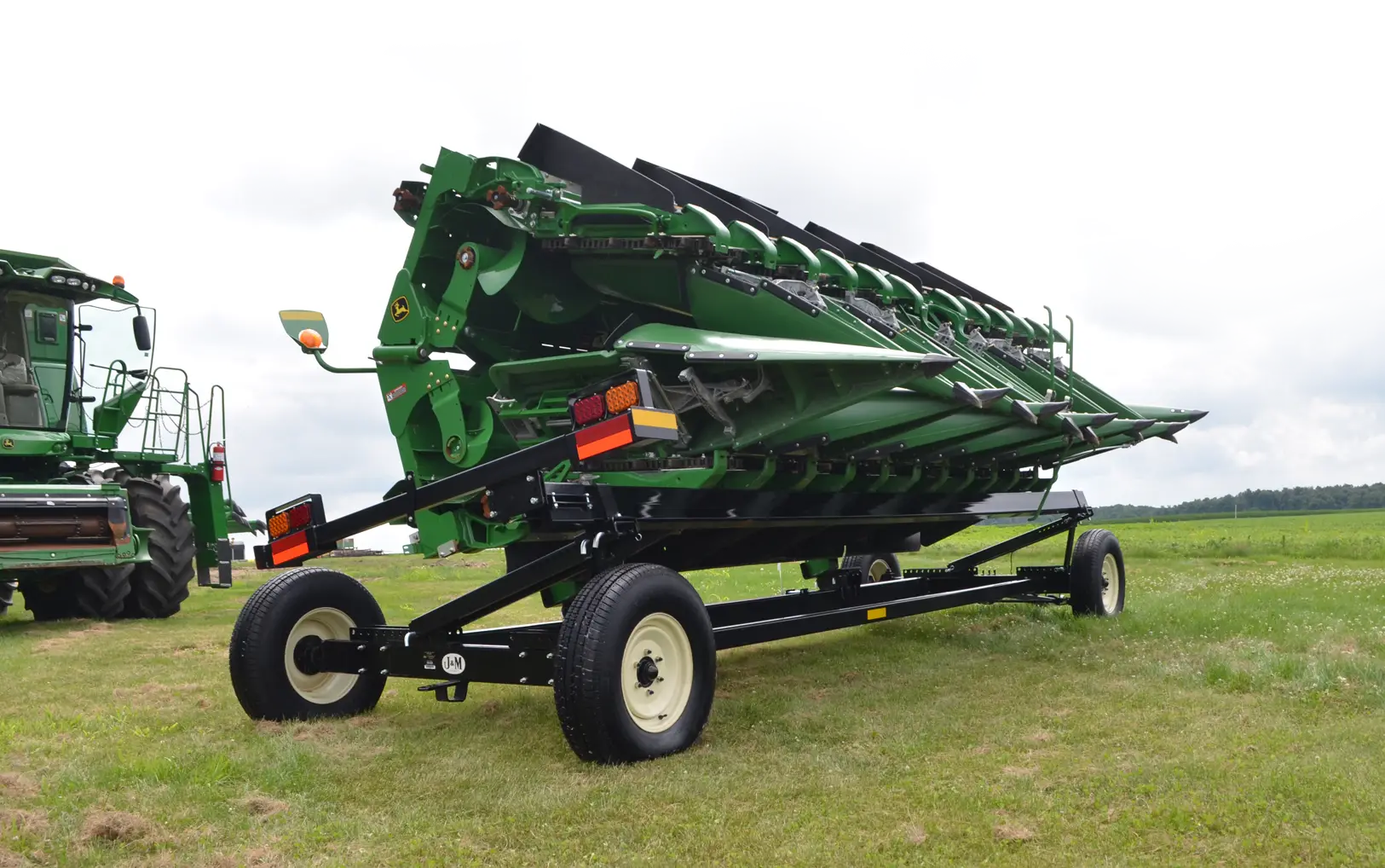 Header Transport Holding a John Deere Folding Combine Head