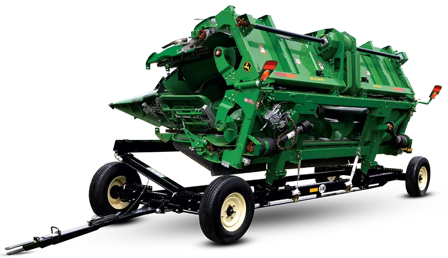 header transport with a green folding corn head on it.