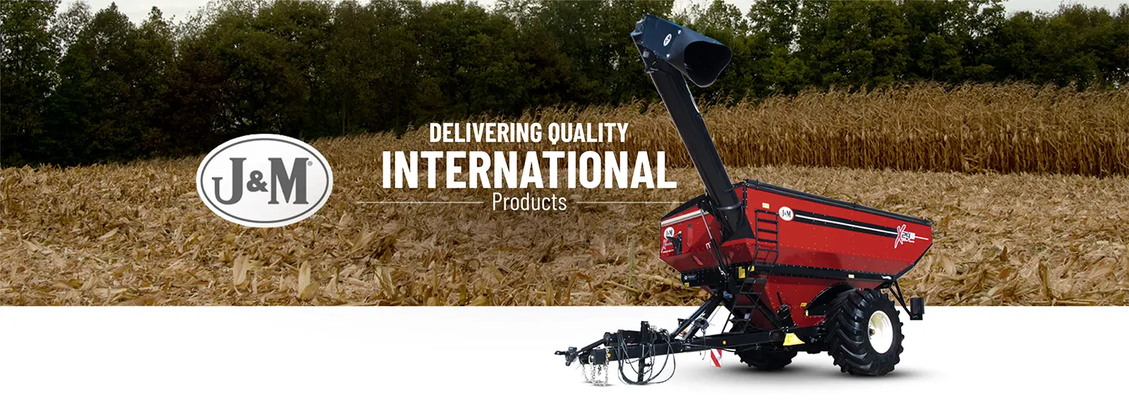 International Grain Cart in front of a corn field
