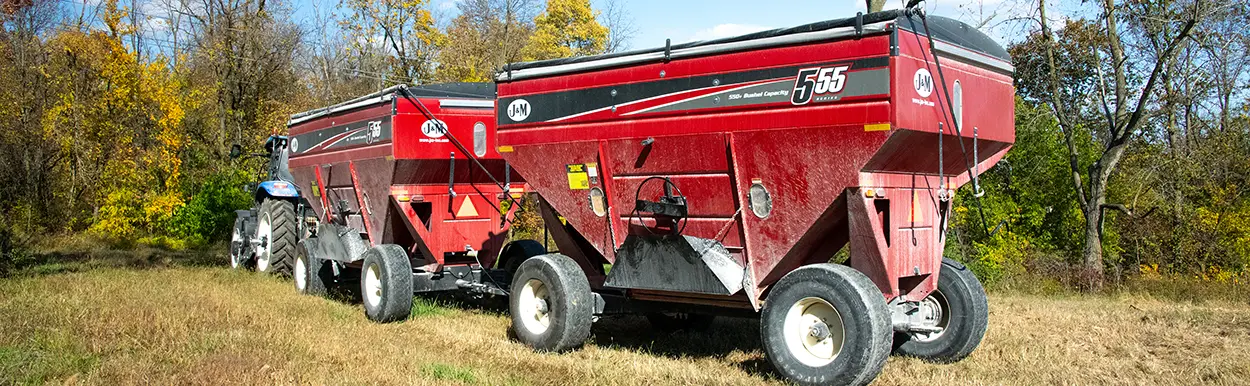 two red 555 gravity wagons