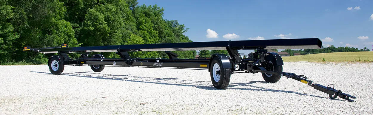 a 4 wheel steer header transport in the lot