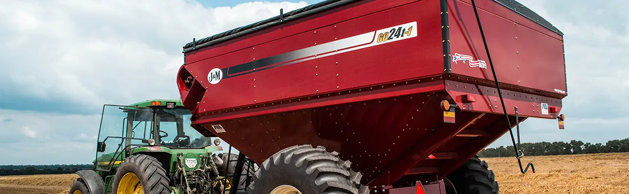 a red grain cart with a bolt together design for easier shipment overseas