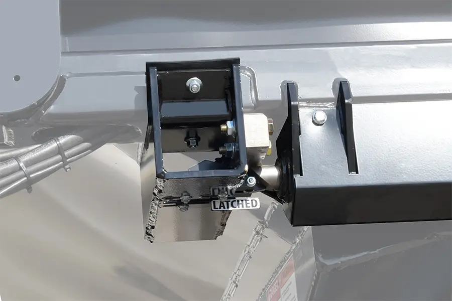 Close up view of the automated conveyor latching system on the LX seed tender with the conveyor latched in place for transport