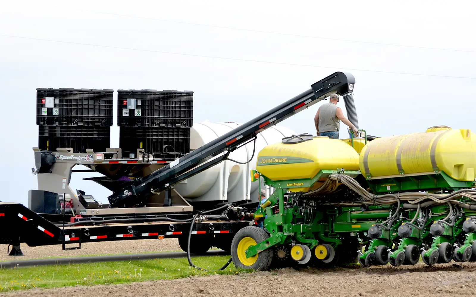 a trailer mounted c450 filling a planter