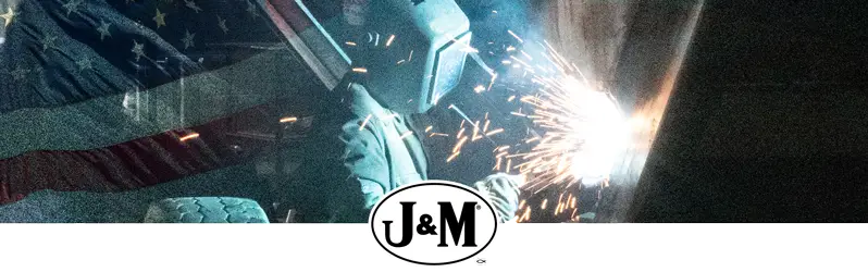 Welder with American flag in the background