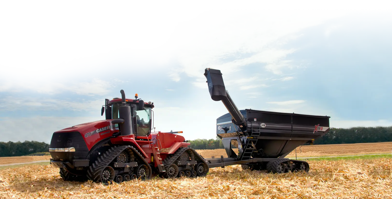 Dual Auger Grain Cart Unloading into a Truck